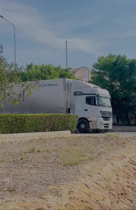 White HFK refrigerated truck parked on site
